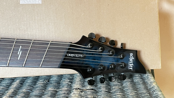 Preview: SCHECTER Omen Elite 8 MultiScale, See Thru Blue Burst, Sonderpreis